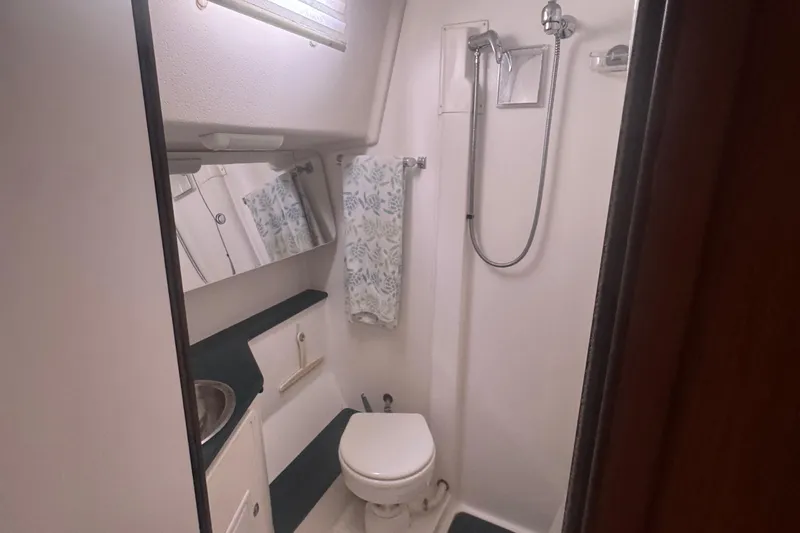 True Love Yacht Photos Pics Bathroom interior of 2005 Catalina Morgan 440 DS yacht with shower and toilet.