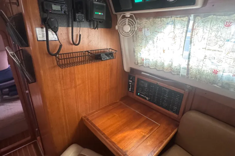 True Love Yacht Photos Pics Interior of 2005 Catalina Morgan 440 DS sailboat with navigation equipment and wooden finish.