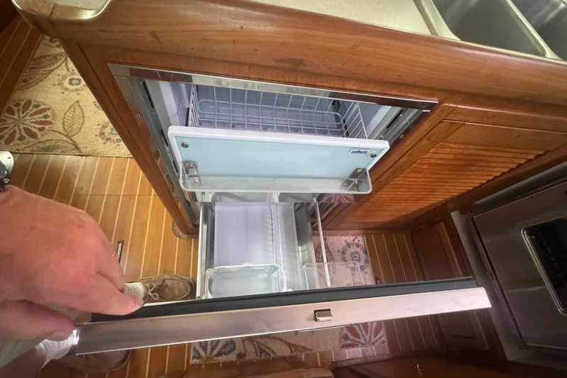 True Love Yacht Photos Pics Interior of 2005 Catalina Morgan 440 DS yacht showing open drawer refrigerator.