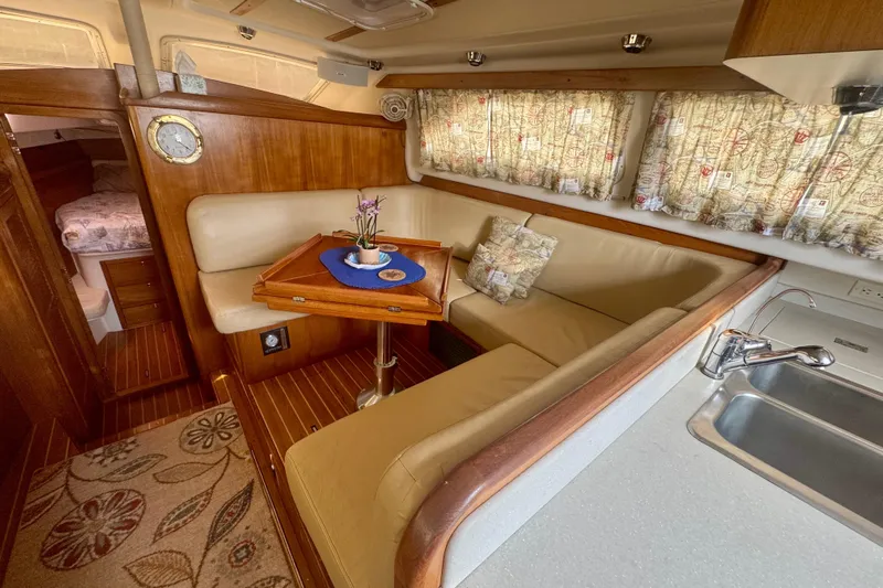 True Love Yacht Photos Pics Interior of 2005 Catalina Morgan 440 DS yacht with cozy seating and wooden accents.