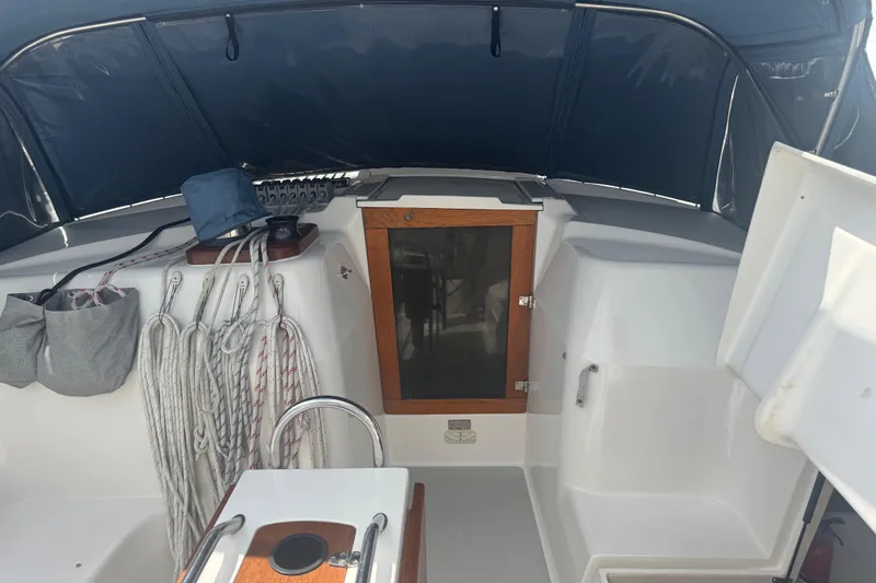 True Love Yacht Photos Pics Cockpit of 2005 Catalina Morgan 440 DS sailboat with ropes and storage compartments.