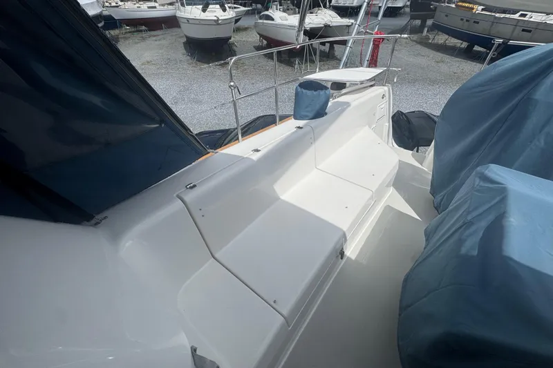 True Love Yacht Photos Pics 2005 Catalina Morgan 440 DS yacht deck with covered seating and nearby boats.