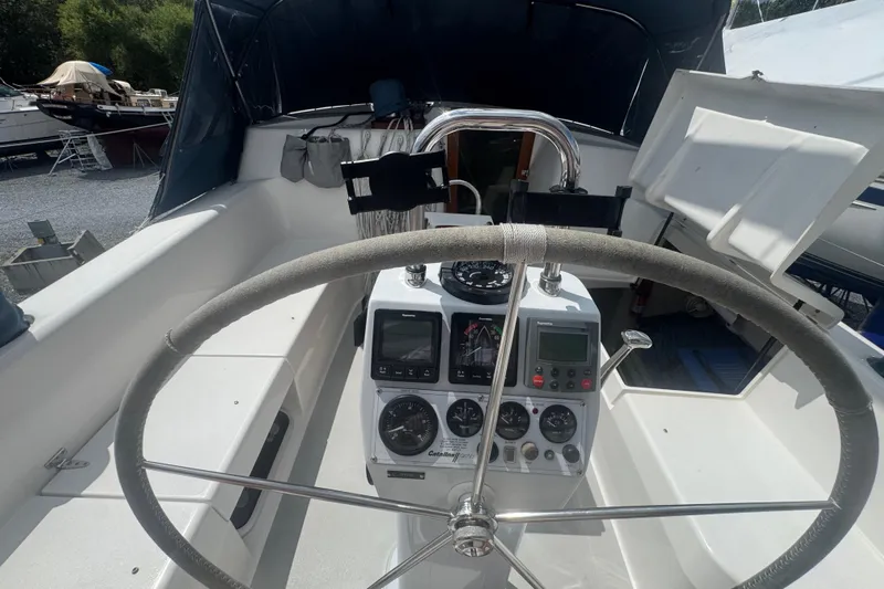 True Love Yacht Photos Pics Cockpit of 2005 Catalina Morgan 440 DS sailboat with steering wheel and navigation instruments.
