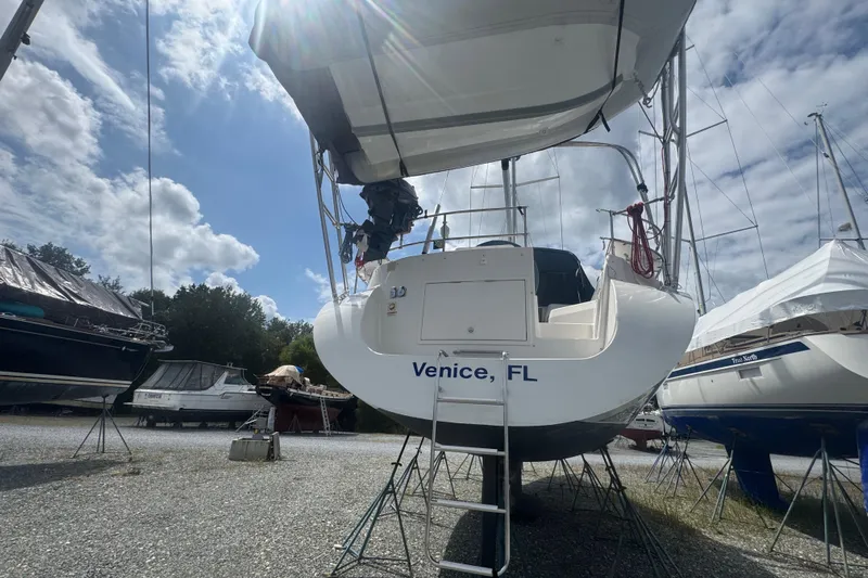 True Love Yacht Photos Pics 2005 Catalina Morgan 440 DS sailboat on stands, Venice, FL, under a partly cloudy sky.