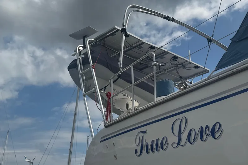 True Love Yacht Photos Pics Catalina Morgan 440 DS 2005 sailboat named "True Love" under cloudy sky.