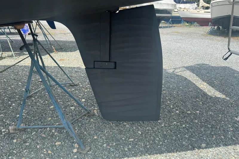 True Love Yacht Photos Pics 2005 Catalina Morgan 440 DS rudder on gravel, supported by metal stands.