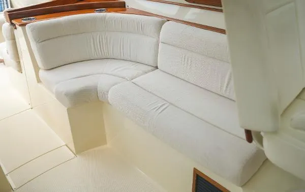  Yacht Photos Pics Luxurious seating area on a 2013 Hinckley Talaria 34 yacht interior.