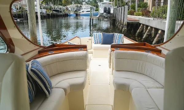  Yacht Photos Pics 2013 Hinckley Talaria 34 boat interior with plush seating and striped cushions.