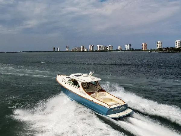  Yacht Photos Pics Hinckley Talaria 34 boat cruising on open water, 2013 model.