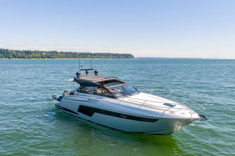  Yacht Photos Pics 2015 Princess V48 yacht cruising on a sunny day in open waters.