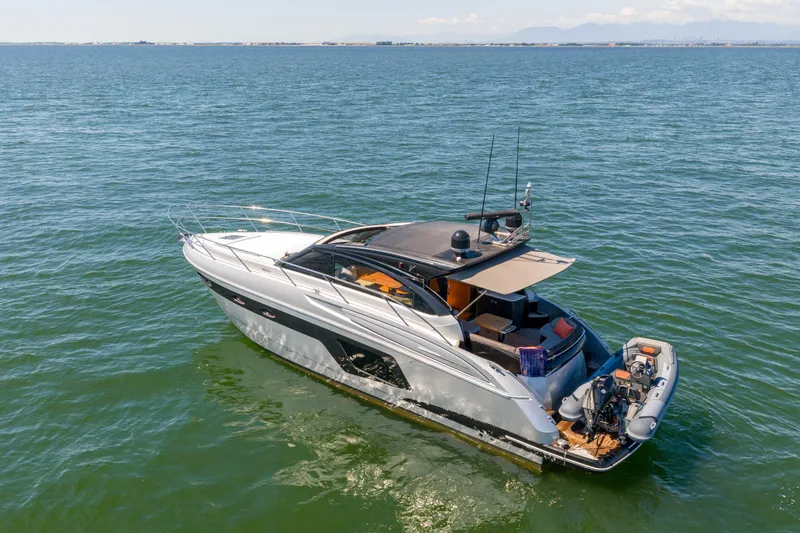  Yacht Photos Pics 2015 Princess V48 yacht cruising on open water, showcasing sleek design and luxury features.