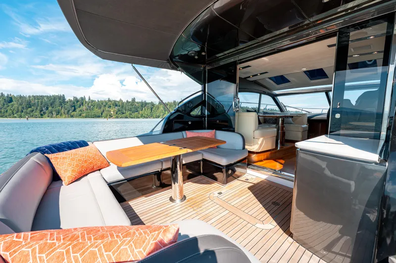  Yacht Photos Pics Luxurious 2015 Princess V48 yacht interior with elegant seating and scenic water view.