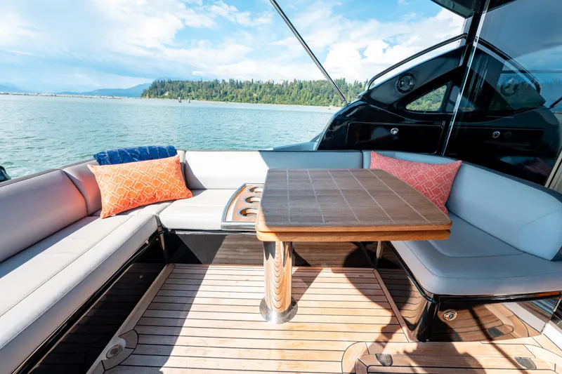  Yacht Photos Pics Luxurious seating area on 2015 Princess V48 yacht with scenic water view.