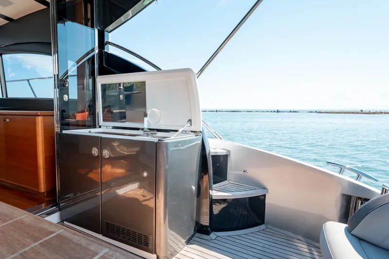 Yacht Photos Pics Luxury 2015 Princess V48 yacht interior with sleek kitchenette and ocean view.