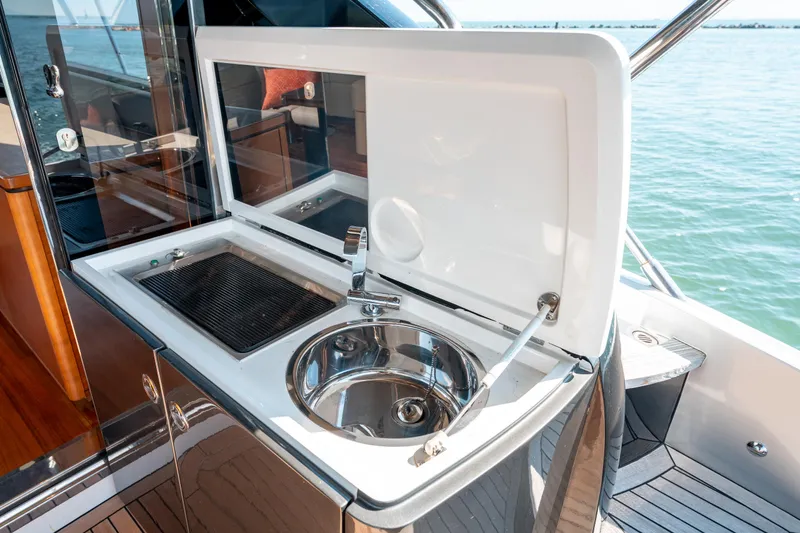  Yacht Photos Pics Outdoor sink and grill on 2015 Princess V48 yacht, overlooking the ocean.