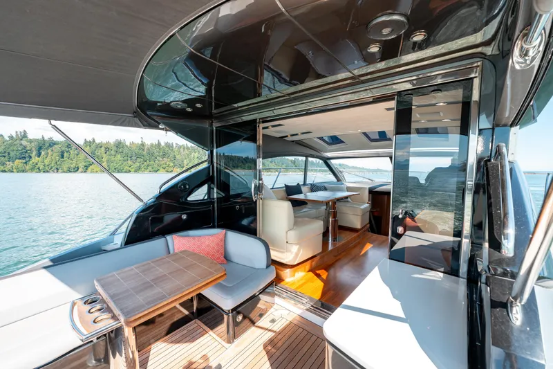  Yacht Photos Pics Luxurious 2015 Princess V48 yacht interior with elegant seating and scenic water view.