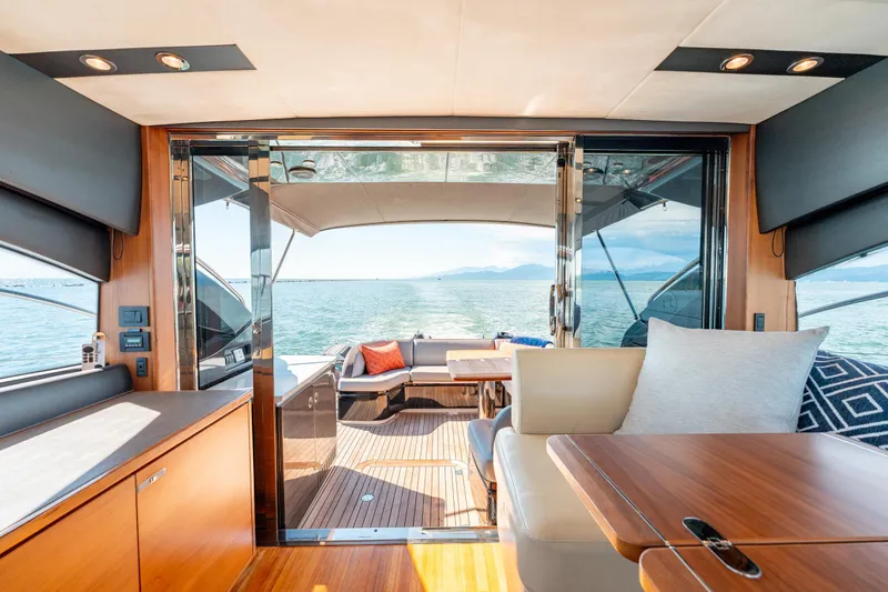  Yacht Photos Pics Interior view of 2015 Princess V48 yacht with ocean backdrop.