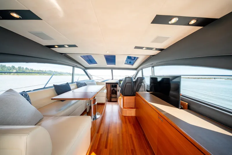  Yacht Photos Pics Luxurious interior of 2015 Princess V48 yacht with elegant seating and panoramic windows.