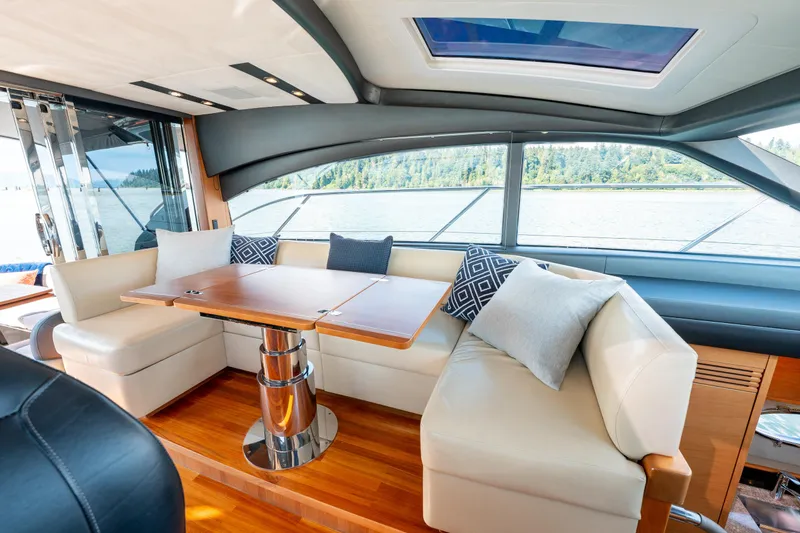  Yacht Photos Pics Luxurious interior of 2015 Princess V48 yacht with elegant seating and scenic window views.