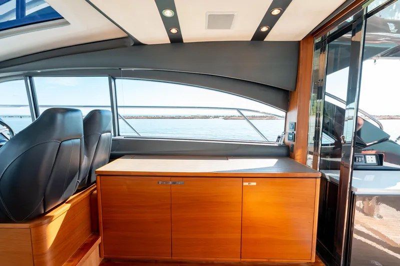  Yacht Photos Pics Interior of 2015 Princess V48 yacht with sleek design and wooden cabinetry.