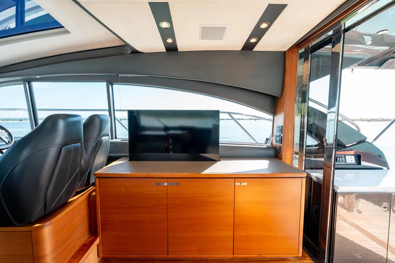  Yacht Photos Pics Luxurious interior of 2015 Princess V48 yacht with sleek design and modern amenities.