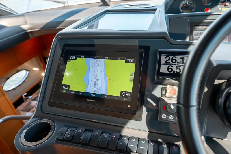  Yacht Photos Pics Cockpit of 2015 Princess V48 yacht with Garmin navigation display and controls.