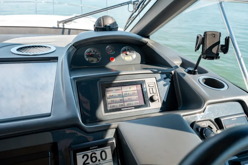  Yacht Photos Pics Control panel of a 2015 Princess V48 yacht with navigation instruments and displays.