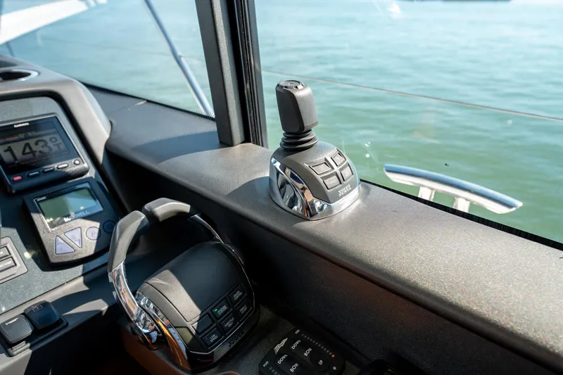  Yacht Photos Pics Control panel of a 2015 Princess V48 yacht with joystick and throttle.