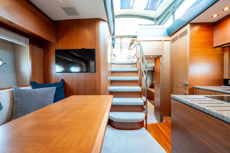  Yacht Photos Pics Luxurious interior of 2015 Princess V48 yacht with wooden finishes and modern amenities.