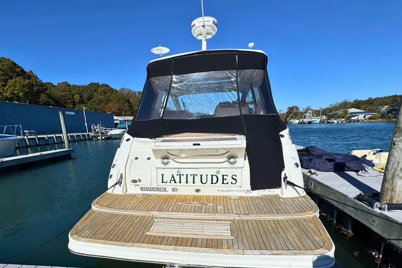  Yacht Photos Pics 2017 Sea Ray Sundancer 350 Coupe docked, rear view with "Latitudes" name visible.
