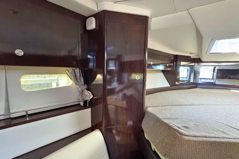  Yacht Photos Pics Luxurious interior of 2017 Sea Ray Sundancer 350 Coupe with elegant wood finishes.