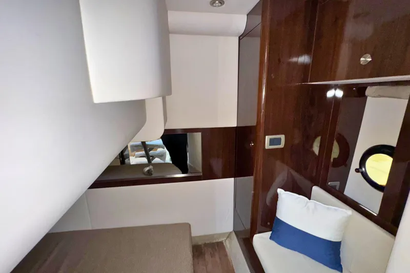  Yacht Photos Pics Interior of 2017 Sea Ray Sundancer 350 Coupe with wood paneling and cozy seating.