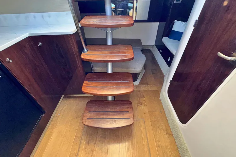  Yacht Photos Pics Interior of 2017 Sea Ray Sundancer 350 Coupe with wooden steps and modern design.