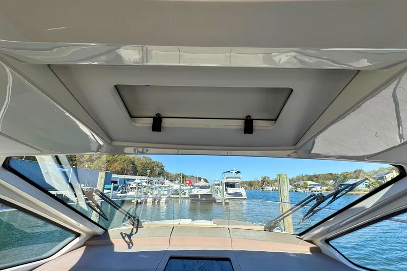  Yacht Photos Pics Interior view from 2017 Sea Ray Sundancer 350 Coupe, overlooking marina with boats.