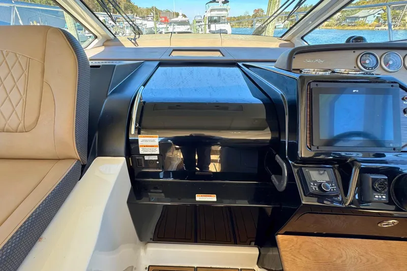  Yacht Photos Pics 2017 Sea Ray Sundancer 350 Coupe helm with navigation controls and leather seating.