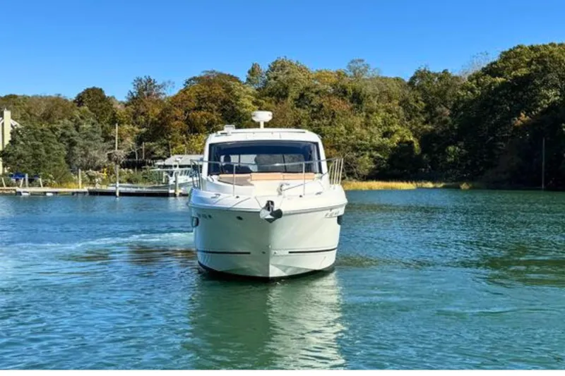  Yacht Photos Pics 2017 Sea Ray Sundancer 350 Coupe cruising on a serene lake.