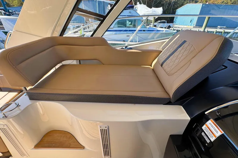  Yacht Photos Pics Luxurious seating on 2017 Sea Ray Sundancer 350 Coupe yacht, featuring tan upholstery.