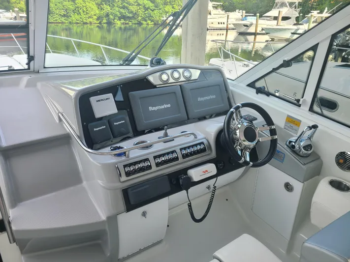  Yacht Photos Pics 2007 Formula 45 Yacht helm with navigation systems and steering wheel.
