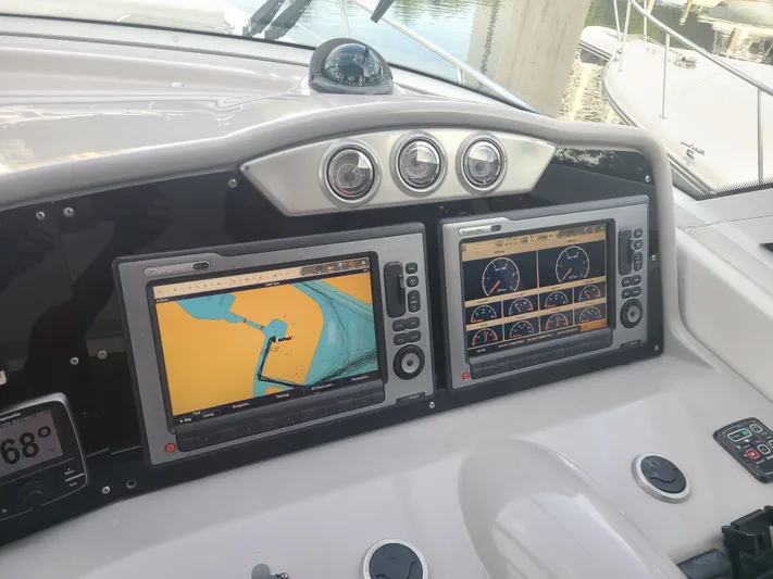  Yacht Photos Pics Dashboard of a 2007 Formula 45 Yacht with dual navigation screens.