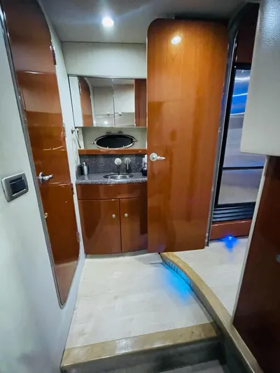  Yacht Photos Pics Interior of 2007 Formula 45 Yacht with wooden cabinetry and modern fixtures.