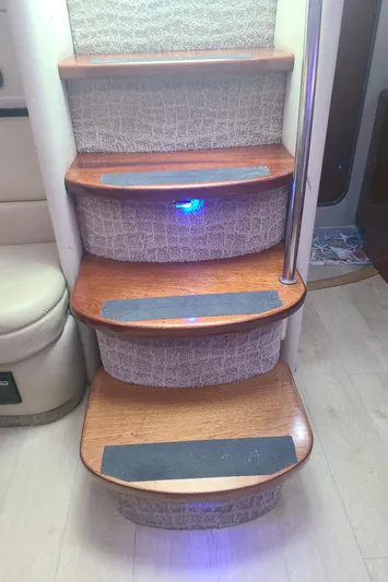  Yacht Photos Pics Staircase inside 2007 Formula 45 Yacht with wooden steps and blue LED lighting.