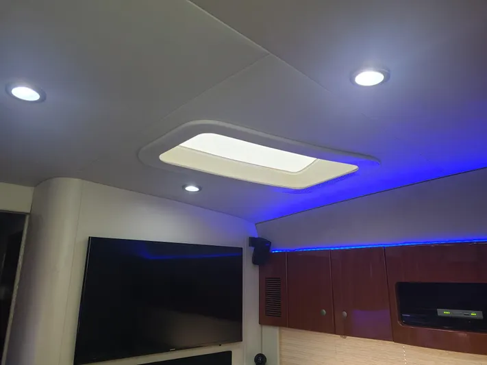  Yacht Photos Pics Interior of 2007 Formula 45 Yacht with skylight, LED lighting, and wooden cabinets.