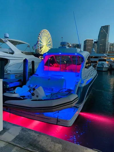  Yacht Photos Pics 2007 Formula 45 Yacht docked at night with vibrant blue and pink lights.