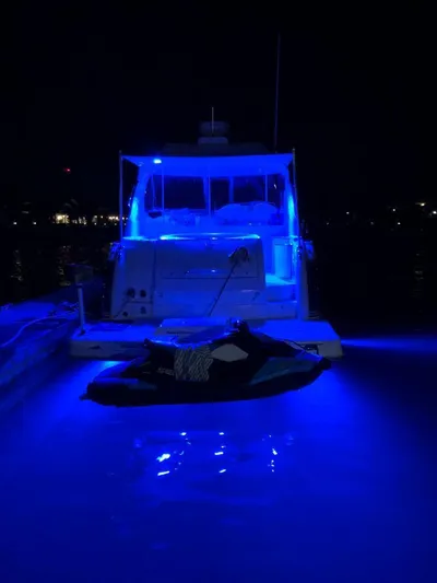  Yacht Photos Pics 2007 Formula 45 Yacht illuminated with blue lights at night.
