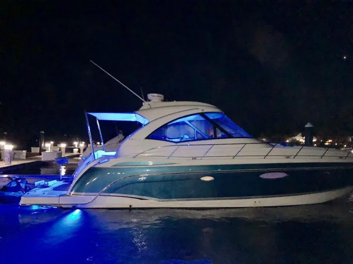  Yacht Photos Pics 2007 Formula 45 Yacht illuminated at night with blue lights.