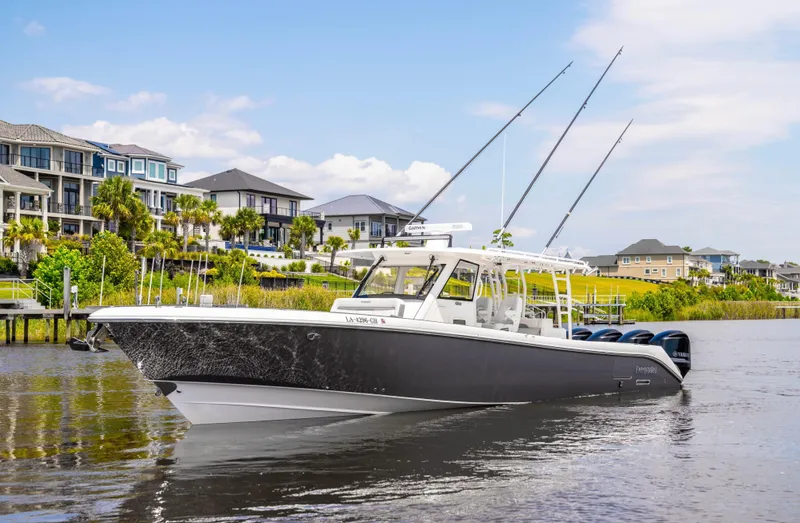  Yacht Photos Pics 2018 Everglades 435 Center Console boat on a scenic waterfront.