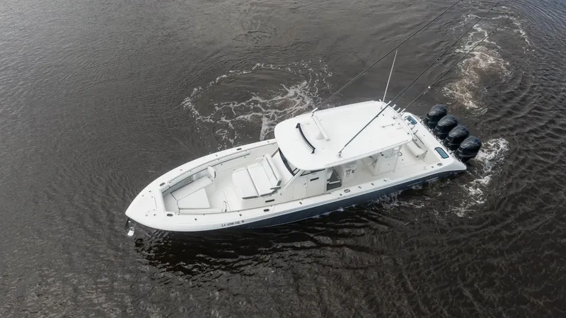  Yacht Photos Pics 2018 Everglades 435 Center Console boat cruising on water, aerial view.