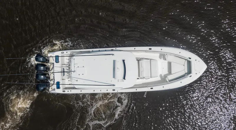  Yacht Photos Pics Aerial view of 2018 Everglades 435 Center Console boat on water.