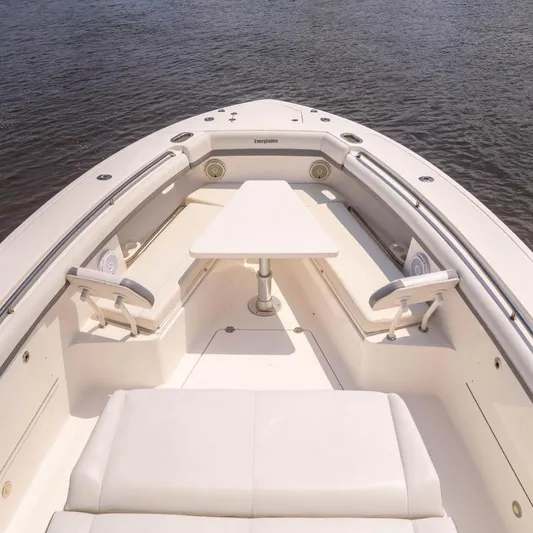  Yacht Photos Pics 2018 Everglades 435 Center Console boat interior with seating and table on water.