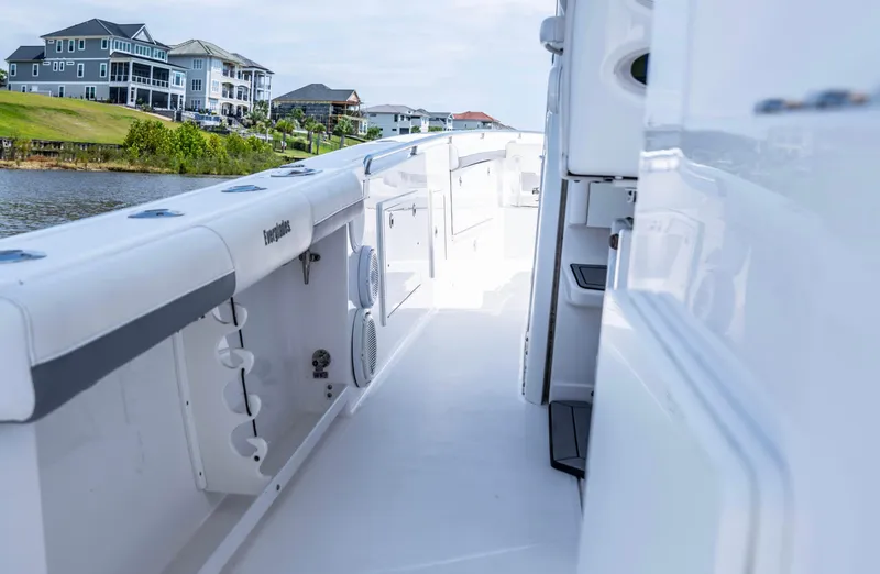  Yacht Photos Pics 2018 Everglades 435 Center Console boat docked near waterfront homes.